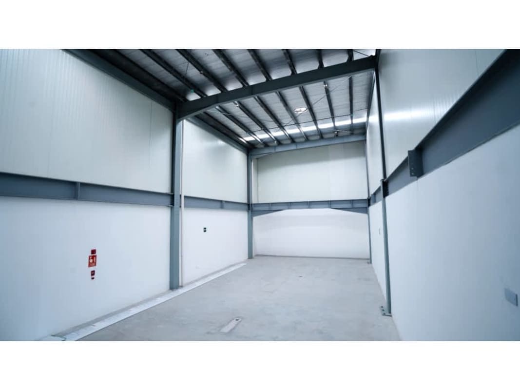 Empty warehouse interior with high ceilings and metal beams in Panama Business Center Chanis Panama