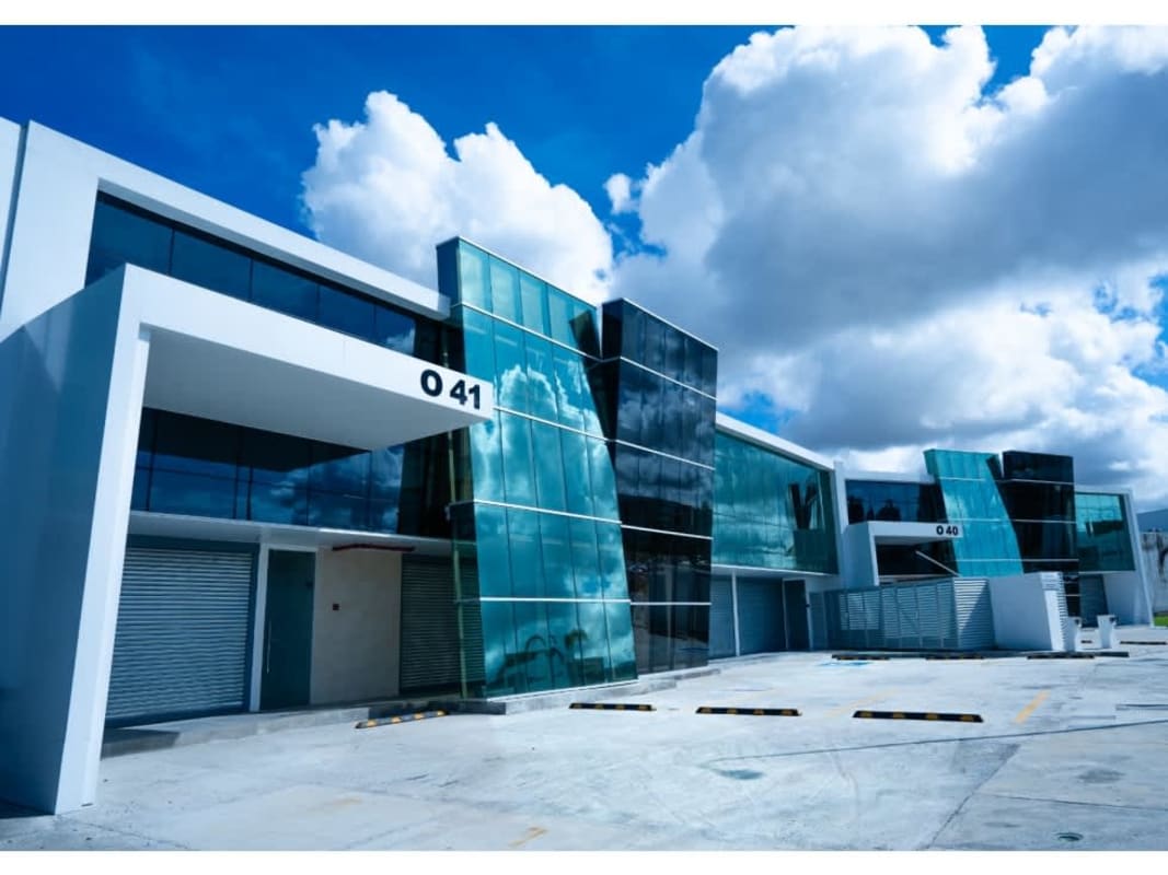 Contemporary commercial building with modern glass facade and loading area in Panama Business Center