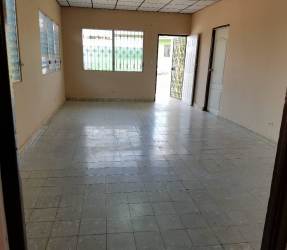 Empty living room with tiled flooring barred windows Barrio Colón house for rent Panama