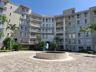 Bedroom with large windows overlooking the ocean in Buenaventura beach condo Panama