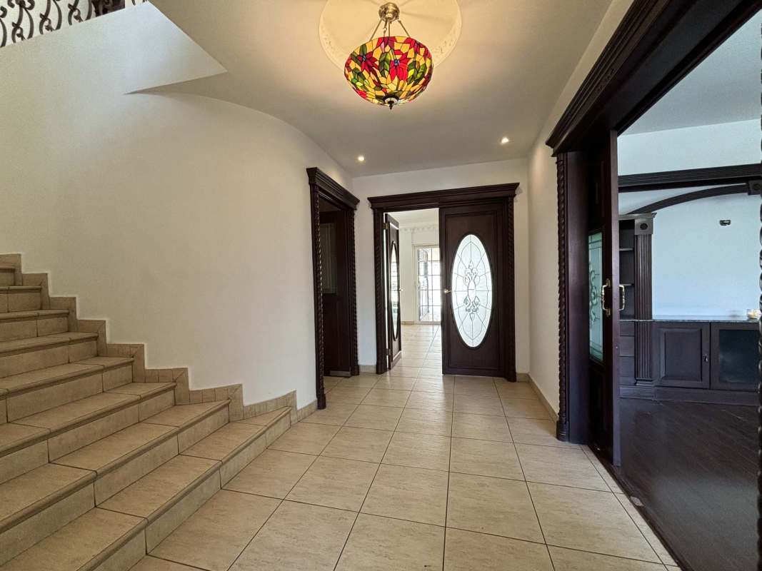 Bright living room with porcelain floors and large windows in luxury house Costa del Este PH Costa Dorada Panama