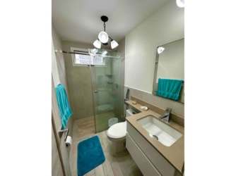 Contemporary bathroom with walk-in shower vanity in Playa Caracol Punta Chame Panama apartment