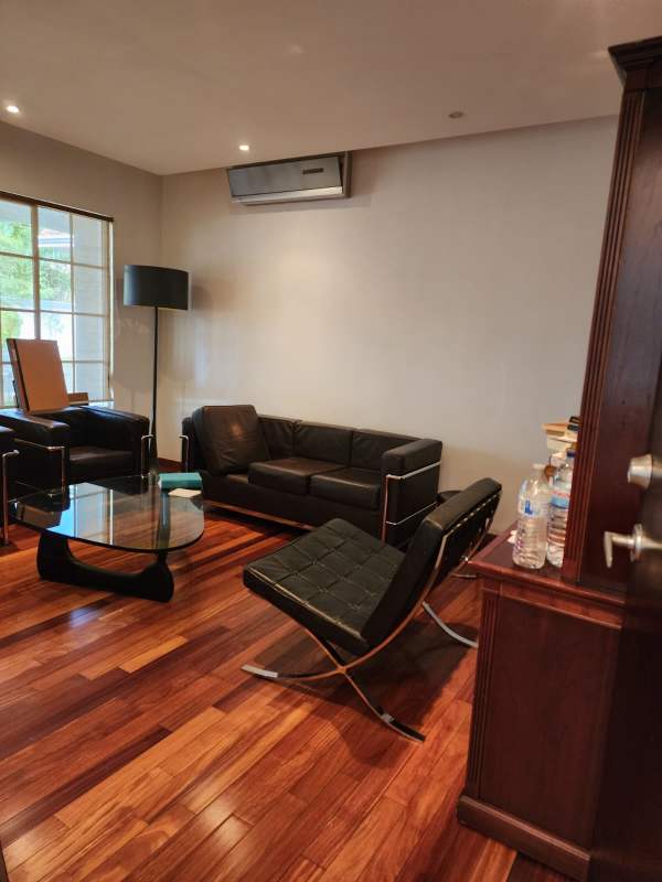 Large living room with wooden floors, AC, natural light Costa del Este luxury home for sale