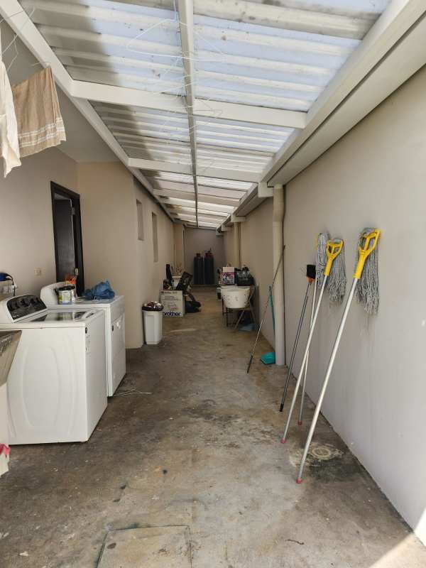 Covered laundry with washer dryer space, storage and translucent roof Costa del Este residence