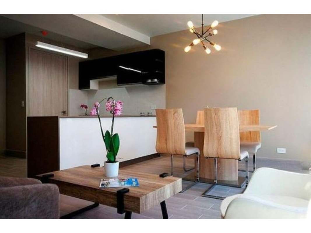 Open-plan living area with large balcony and panoramic city views in Bella Vista Panama apartment