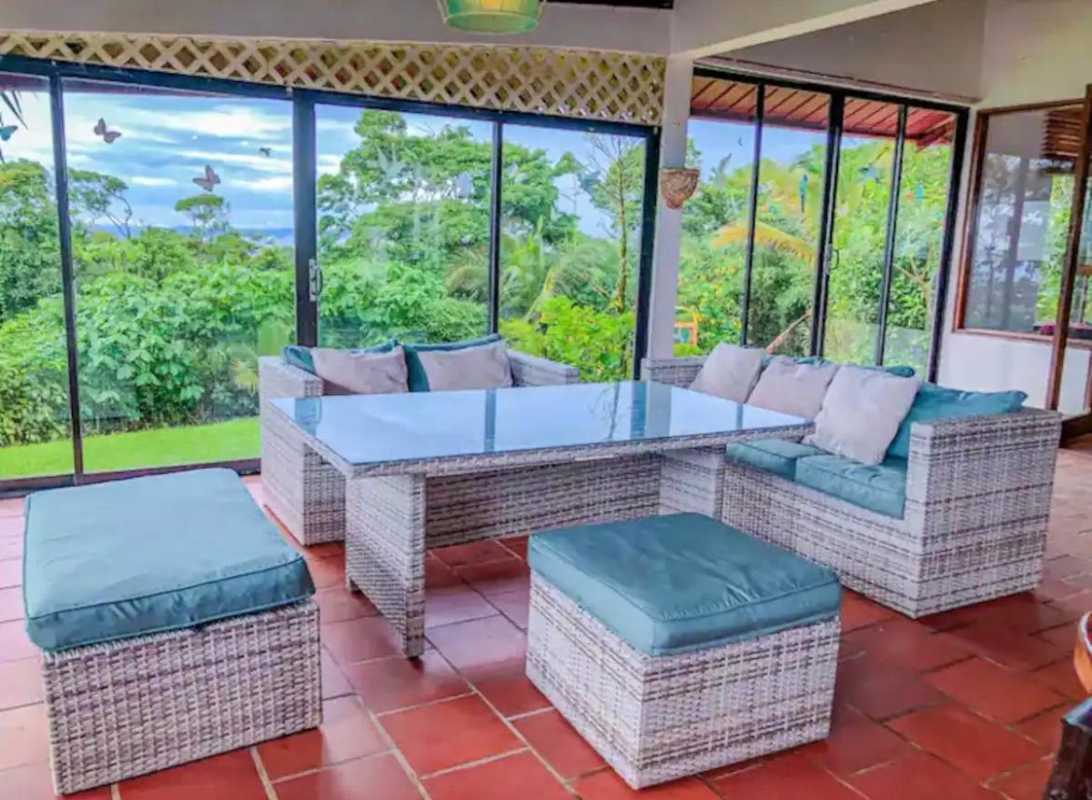 Modern L-shaped kitchen with stainless steel appliances, granite counters, white cabinets, Cerro Azul home