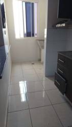 Narrow modern kitchen with cabinetry and window PH Vista Azul Arraiján Panama