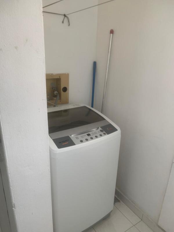 Small laundry zone with washing machine hookup in PH Marble Tower Panama