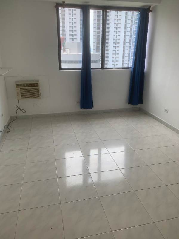 Bright living room with tiled floor, large window, urban view at PH Marble Tower Panama