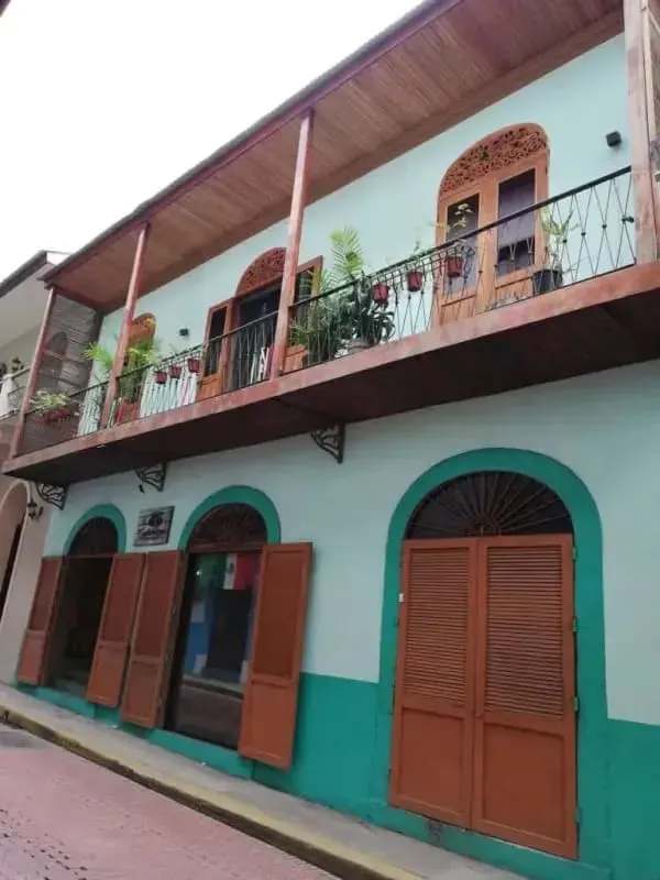 Restored colonial style façade with arches, balconies, wooden shutters in Casco Antiguo Panama