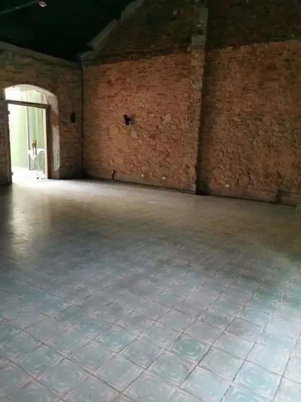 Rustic interior with brick walls and arched doorway in commercial property for sale Casco Viejo Panama