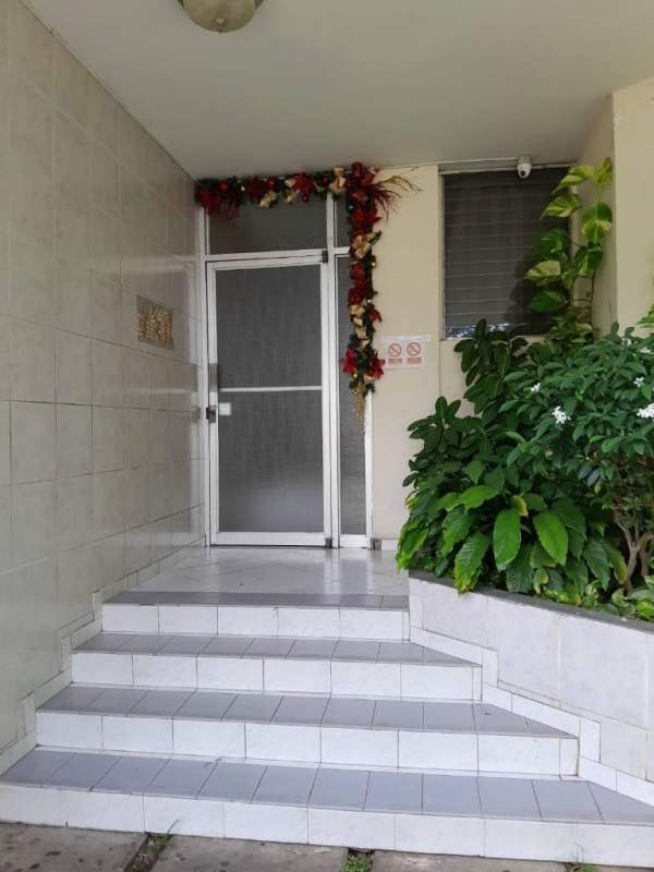 Bright bedroom space with garden view and tile floors at Torres Jardines Costa del Este Panama for rent