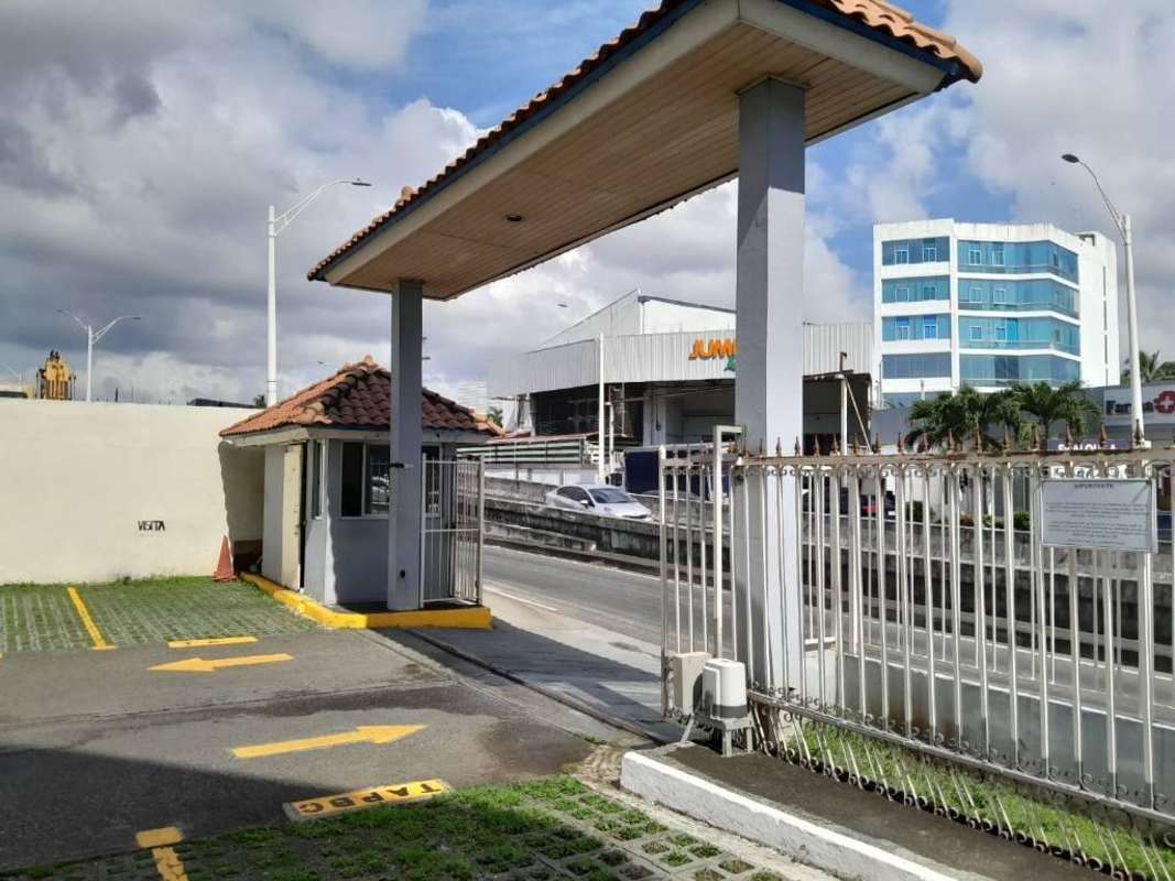 Exterior apartment complex view with parking spaces at Torres Jardines Costa del Este Panama