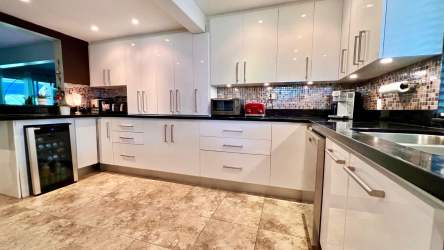 Covered balcony with view of golf course and tropical gardens in Royal Decameron Townhouse Panama