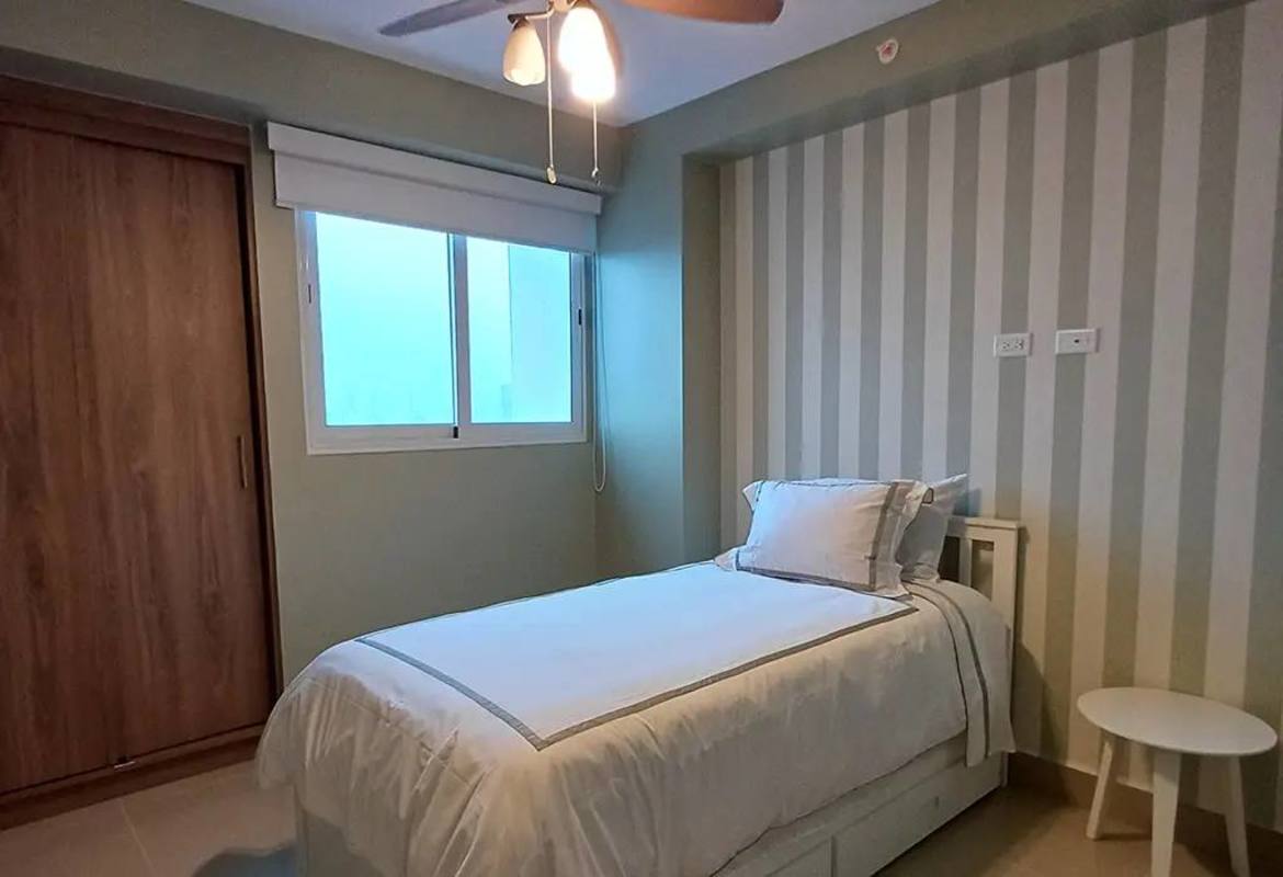 Minimalist style bedroom with striped accent wall built-in closet PH T7 Panama City Panama