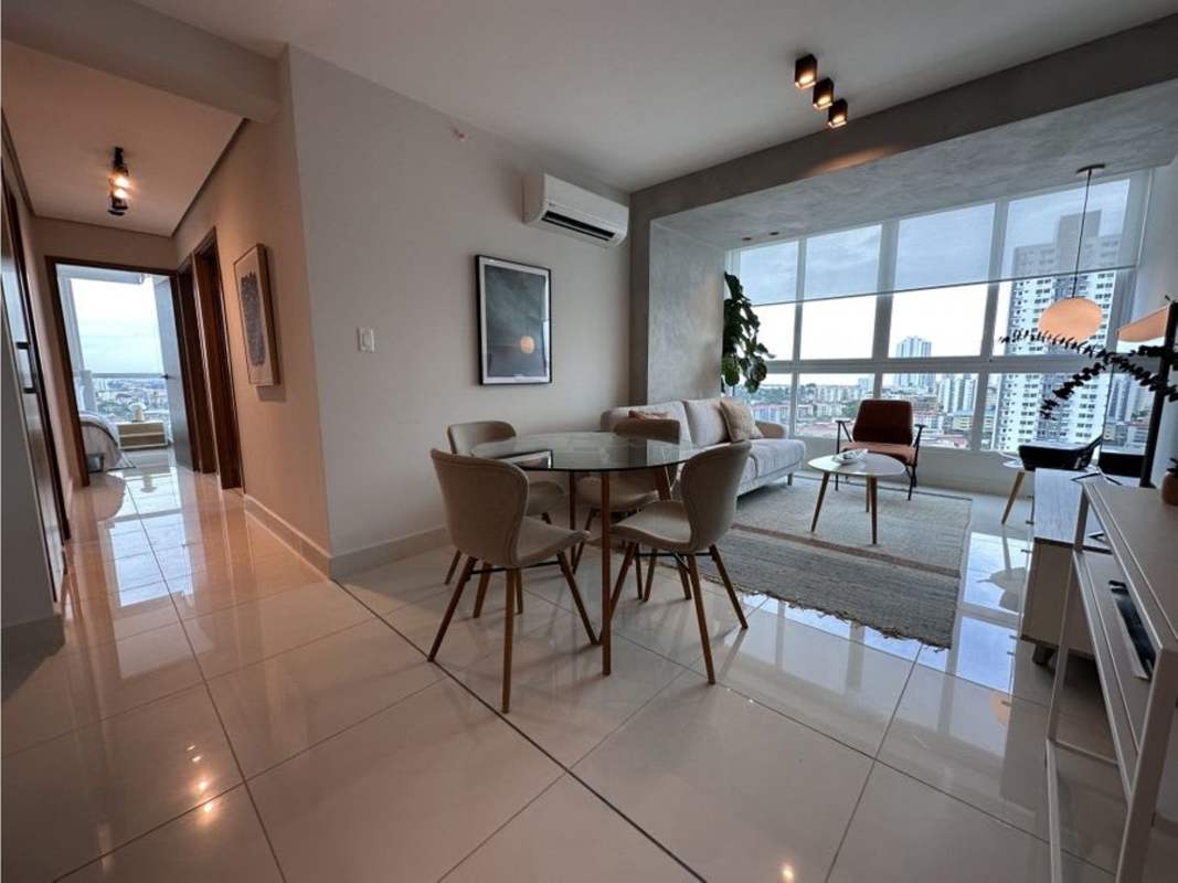 Modern living room in PH T7 with large windows city skyline views Panama City