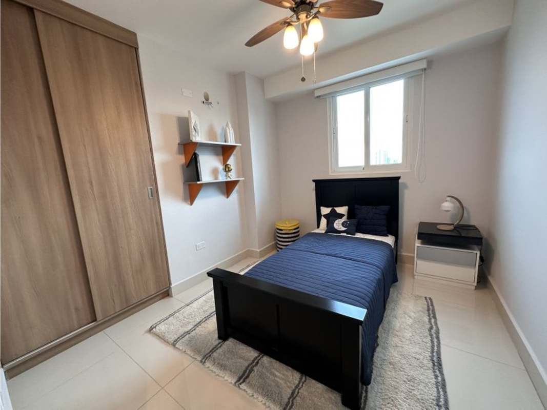 Bedroom in PH T7 condo Panama City with large window, built-in closet and ceiling fan
