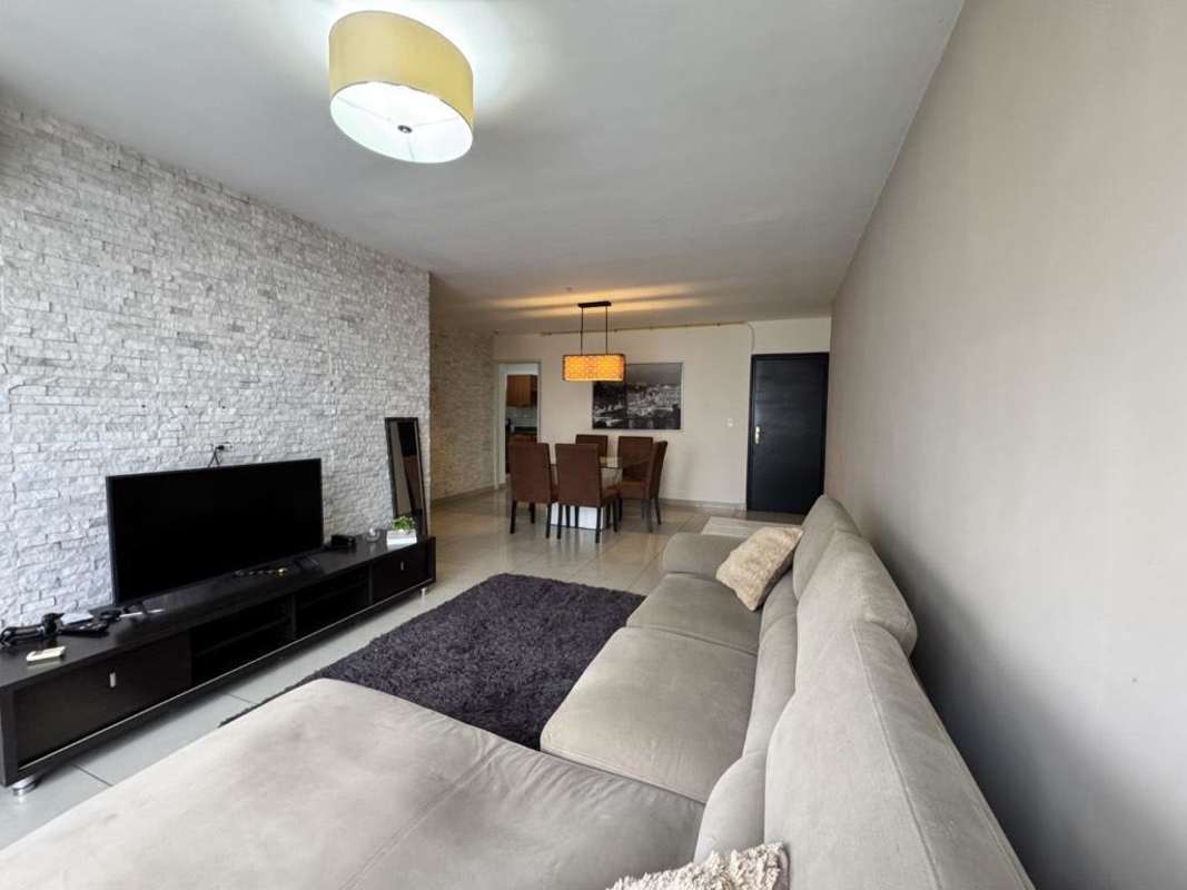 Open living and dining space with modern furniture and city views PH San Francisco Bay Panama