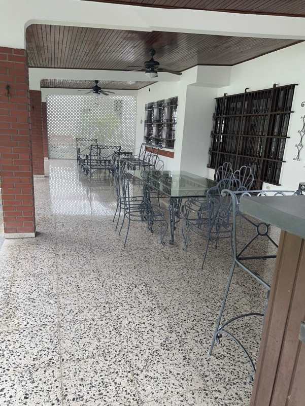 Bright living room featuring terrazzo floor, natural light, security window grills in luxury home Altos de Golf Panama
