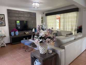 Contemporary dining room with large table, chandelier, and terrace access Royal Decameron Farallón Panama townhouse