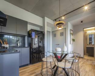 Bathroom with walk-in shower, stylish vanity and tile work in Cocoli Residences