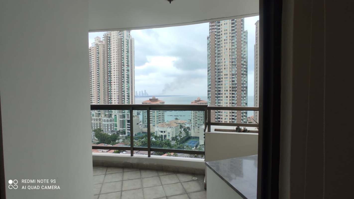 Large living room with marble floors and balcony view at PH Ocean Park Punta Pacífica