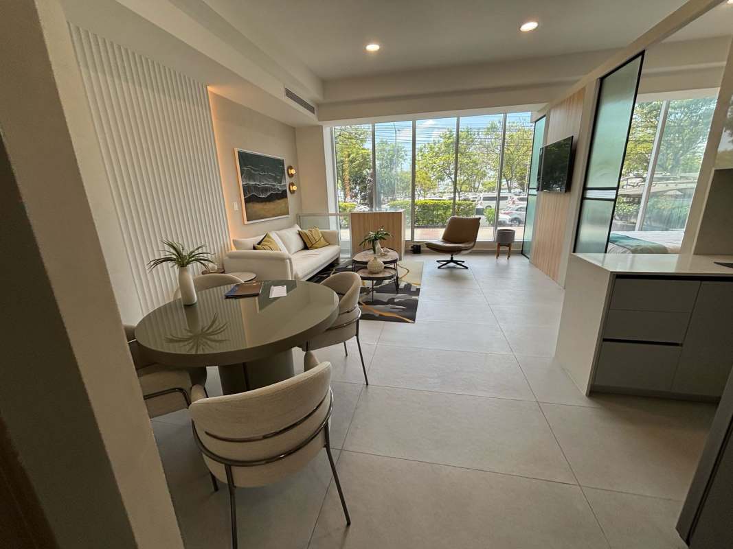 Open concept living dining area large windows PH BICSA Panama furnished studio apartment