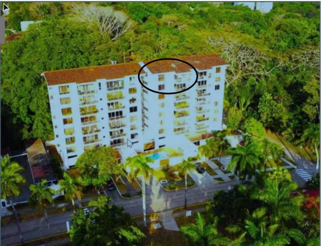 Private balcony with glass railing, ceiling fan and views over Kiwanis Park Ciudad del Saber Clayton Panama