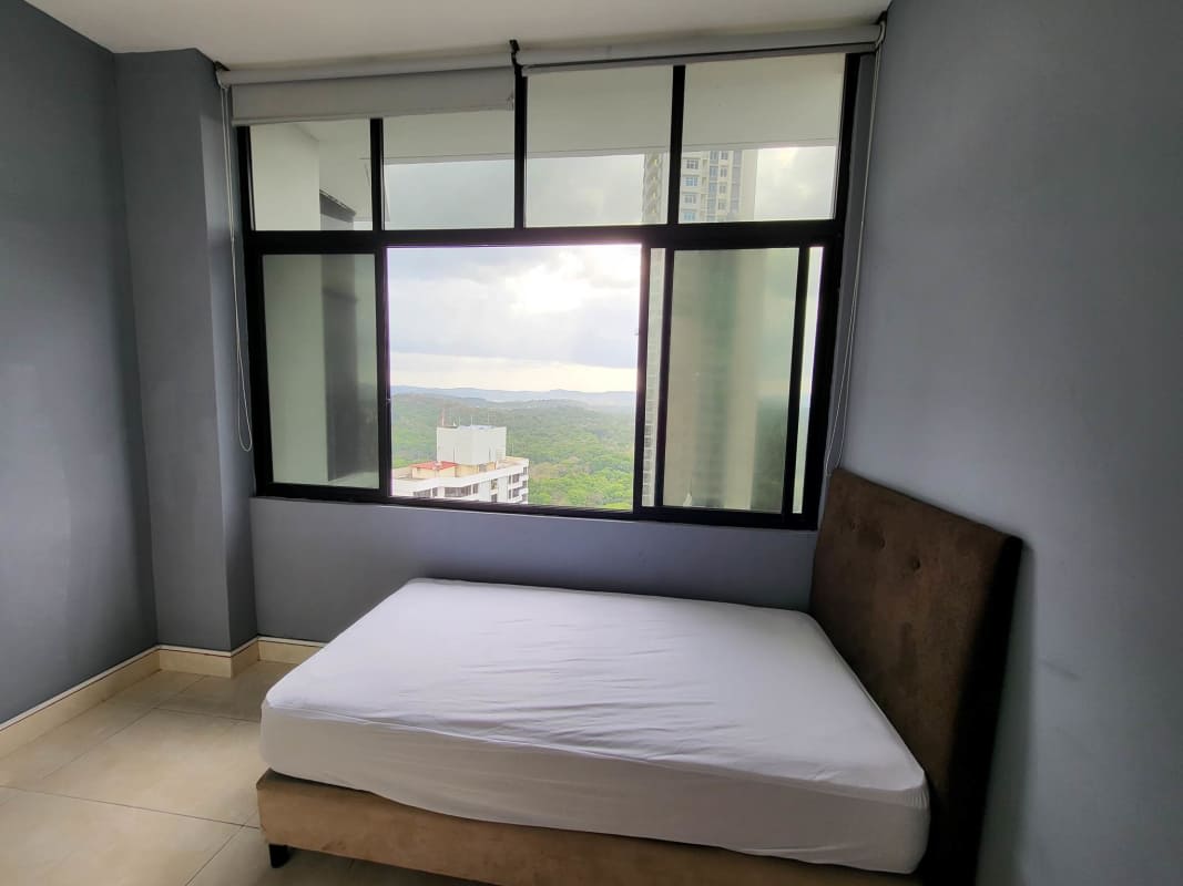 Kitchen with modern cabinets, double sink, stove, microwave, and fridge PH Pacific Hills Dos Mares