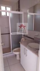 Modern bathroom with glass shower enclosure and granite countertop in Arraiján Panama apartment