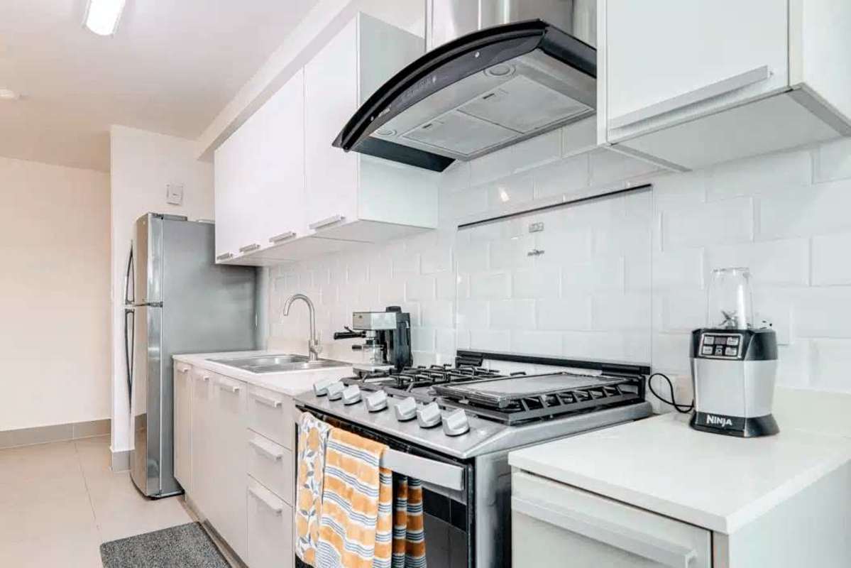 Contemporary bathroom with tile finishes and glass enclosed shower in PH Altamira Residences Panama City