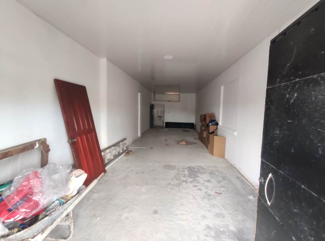 Storefront entrance on ground floor of PH Plaza Lefevre with parking area in Parque Lefevre Panama City