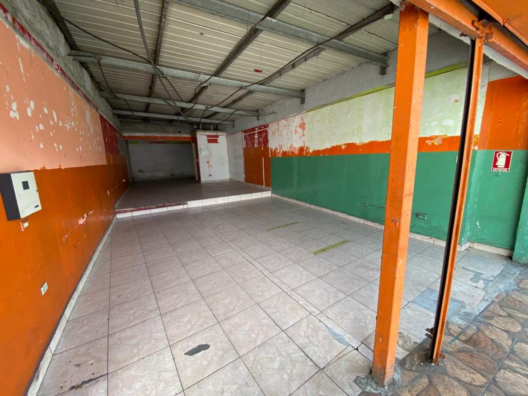 Commercial property in Pedregal with metal shutters and front parking barrier cones Panama