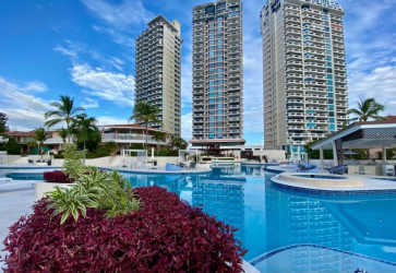 Modern open kitchen with granite counters and stainless appliances in PH Coronado Country Club Panama