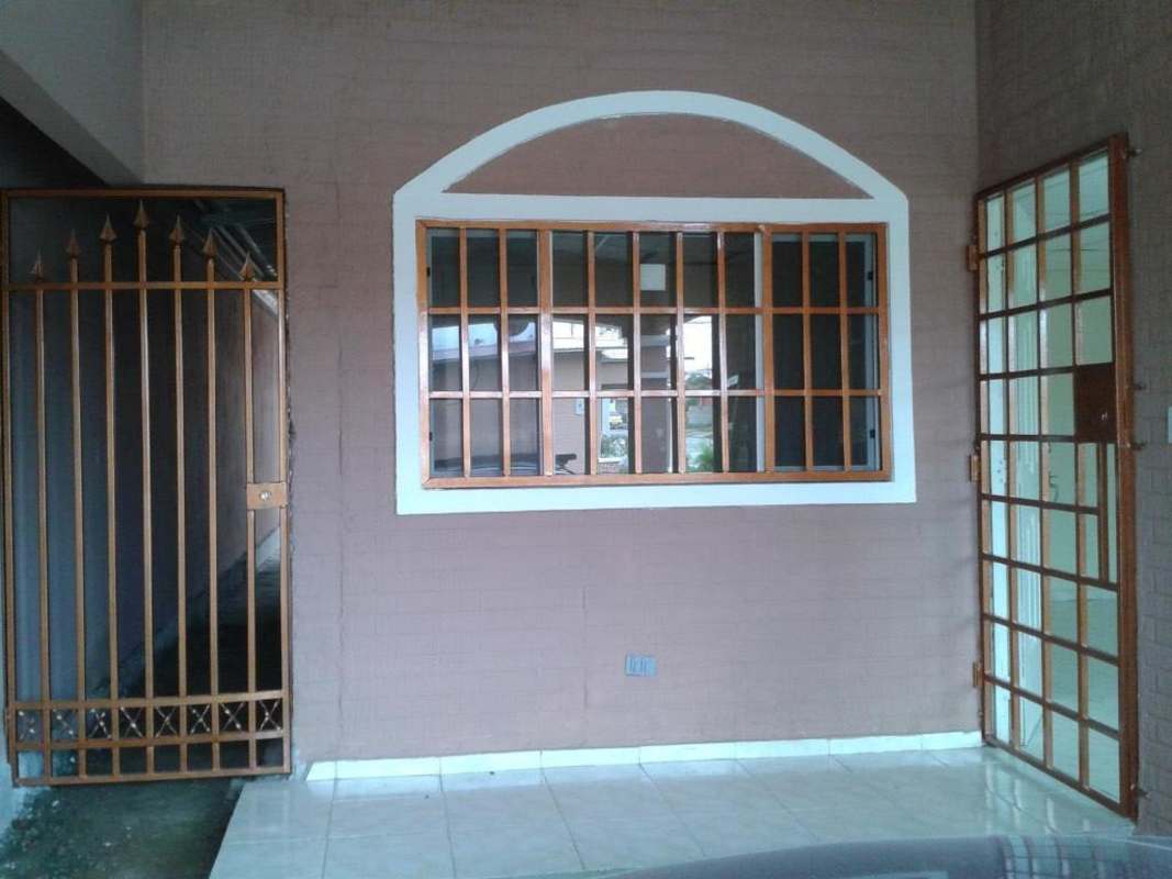 Small enclosed front entry space with metal barred doors and painted walls Villa Zaita house rental