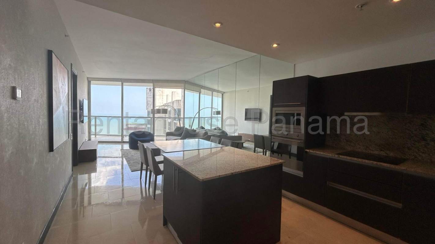 Modern kitchen with granite finishes, built-in appliances and cabinetry at PH Oceana Panama