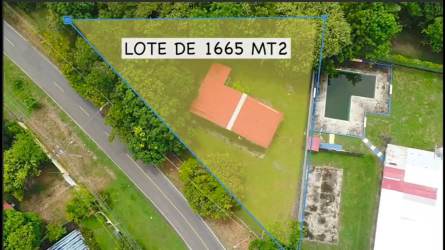 Simple one-story house with flat roof and barred windows on spacious green lot Nueva Gorgona Panama