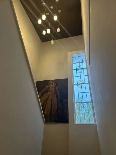 Modern staircase with decorative window and pendant light San Francisco Panama
