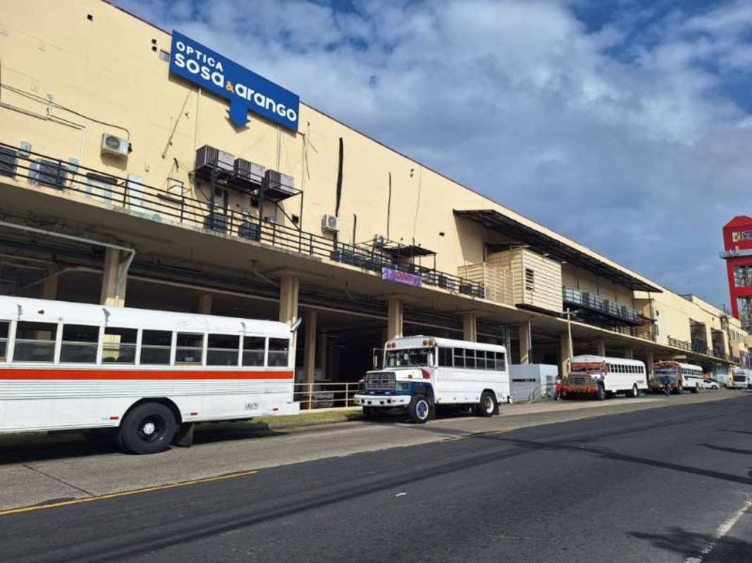 Exterior large commercial building with signage and metro access in San Miguelito Panama