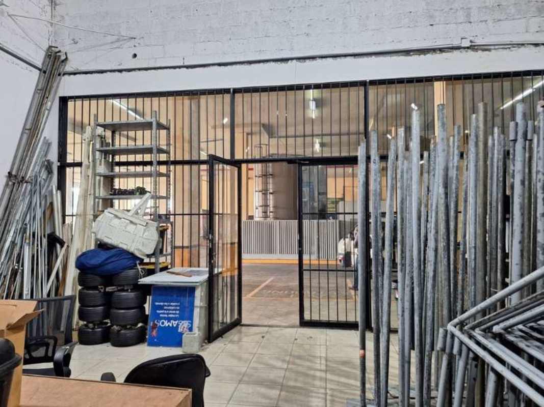 Storage warehouse interior with shelving and materials Victoriano Lorenzo San Miguelito