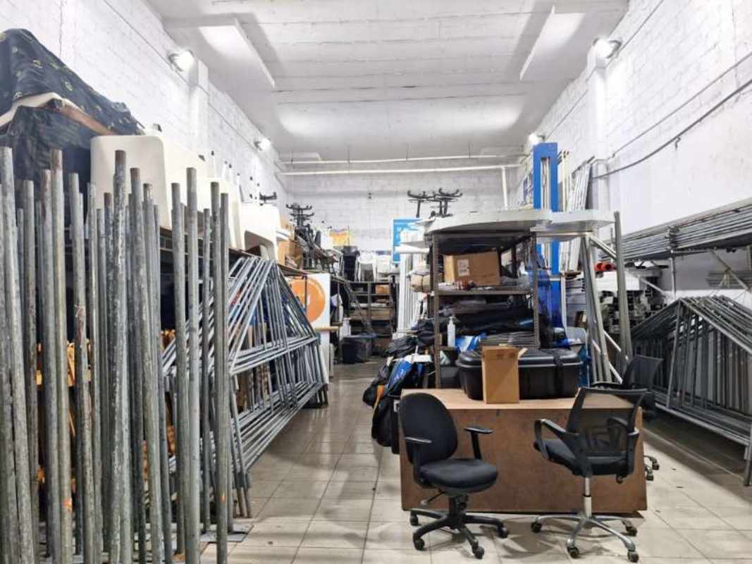 Warehouse interior with parking, closed shutters at Victoriano Lorenzo San Miguelito