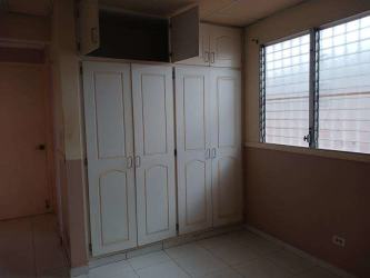 Simple interior room with neutral beige walls, tile floors in Villas del Campo La Chorrera Panama