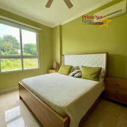 Spacious master bedroom with light decor, large windows and AC at Bijao Beach Resort Panama