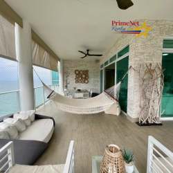 Terrace area with hammock and outdoor sofa facing Pacific Ocean at Bijao luxury condo