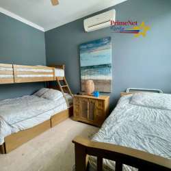 Beach-themed guest bedroom with bunk bed, twin bed, AC, in luxury condo Rio Hato Panama
