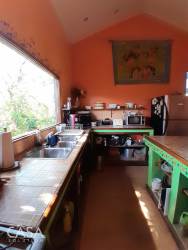 Large covered terrace overlooking lush gardens in Alto Boquete country home