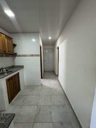 Kitchen and corridor view with traditional cabinets Penonomé apartment