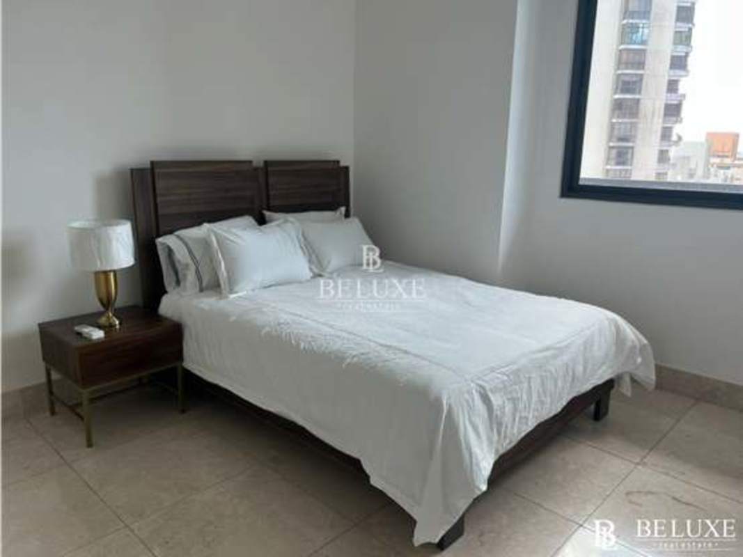 Bedroom with large window panoramic ocean view and ensuite bath Punta Paitilla Panama