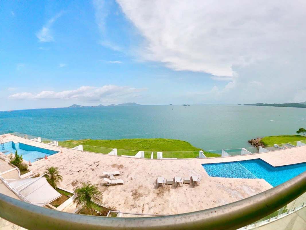 Contemporary kitchen with granite countertop, appliances, breakfast bar in Amador Panama City condo