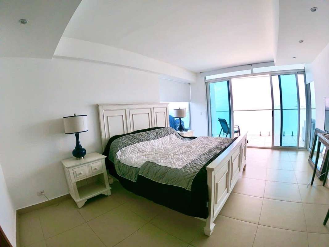 Modern open living area with large windows balcony ocean views in Amador Panama rental
